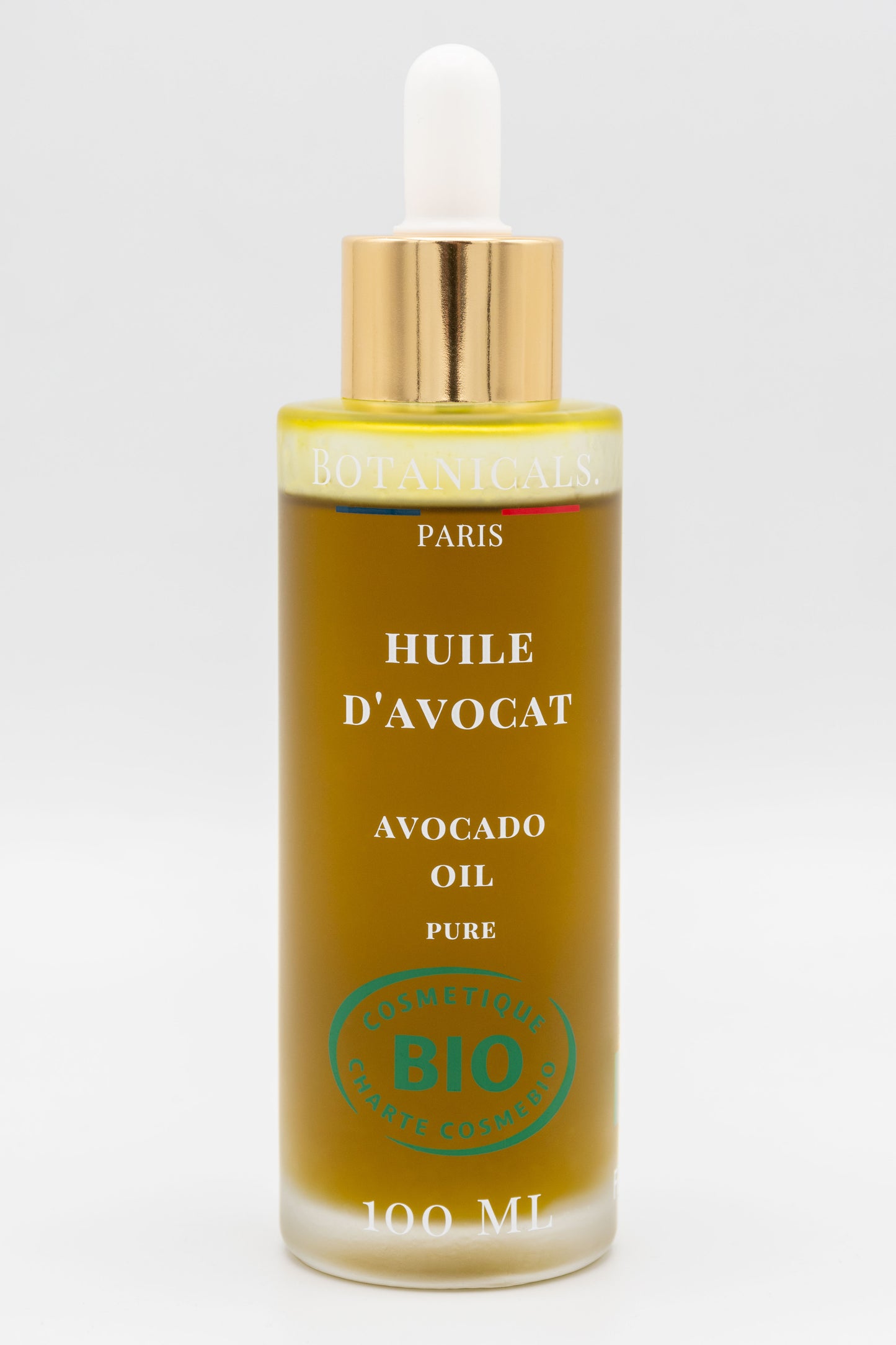 Une bouteille d'huile d'avocat bio 100ml Botanicals sur fond blanc