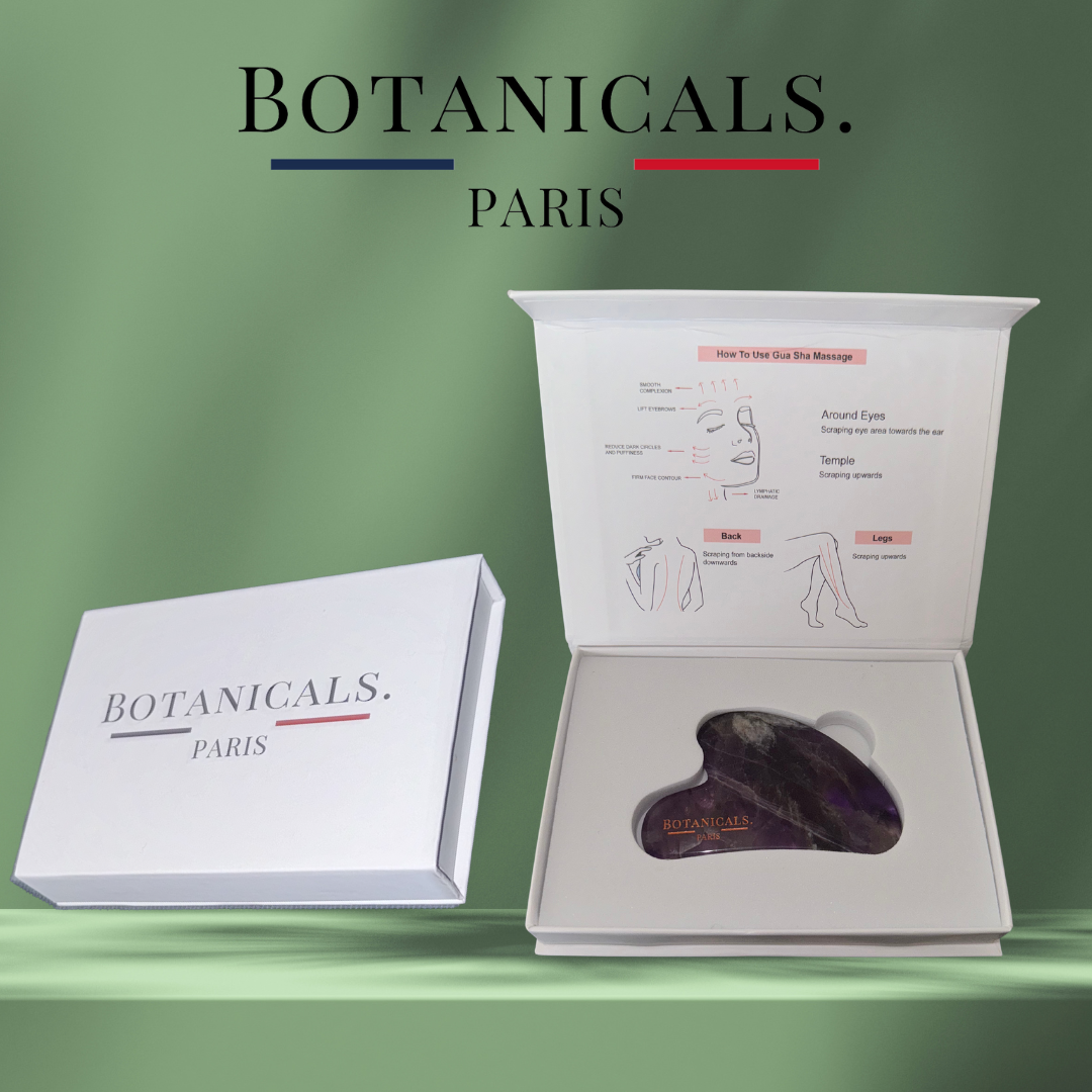 Guasha Botanicals en améthyste posé dans son étui