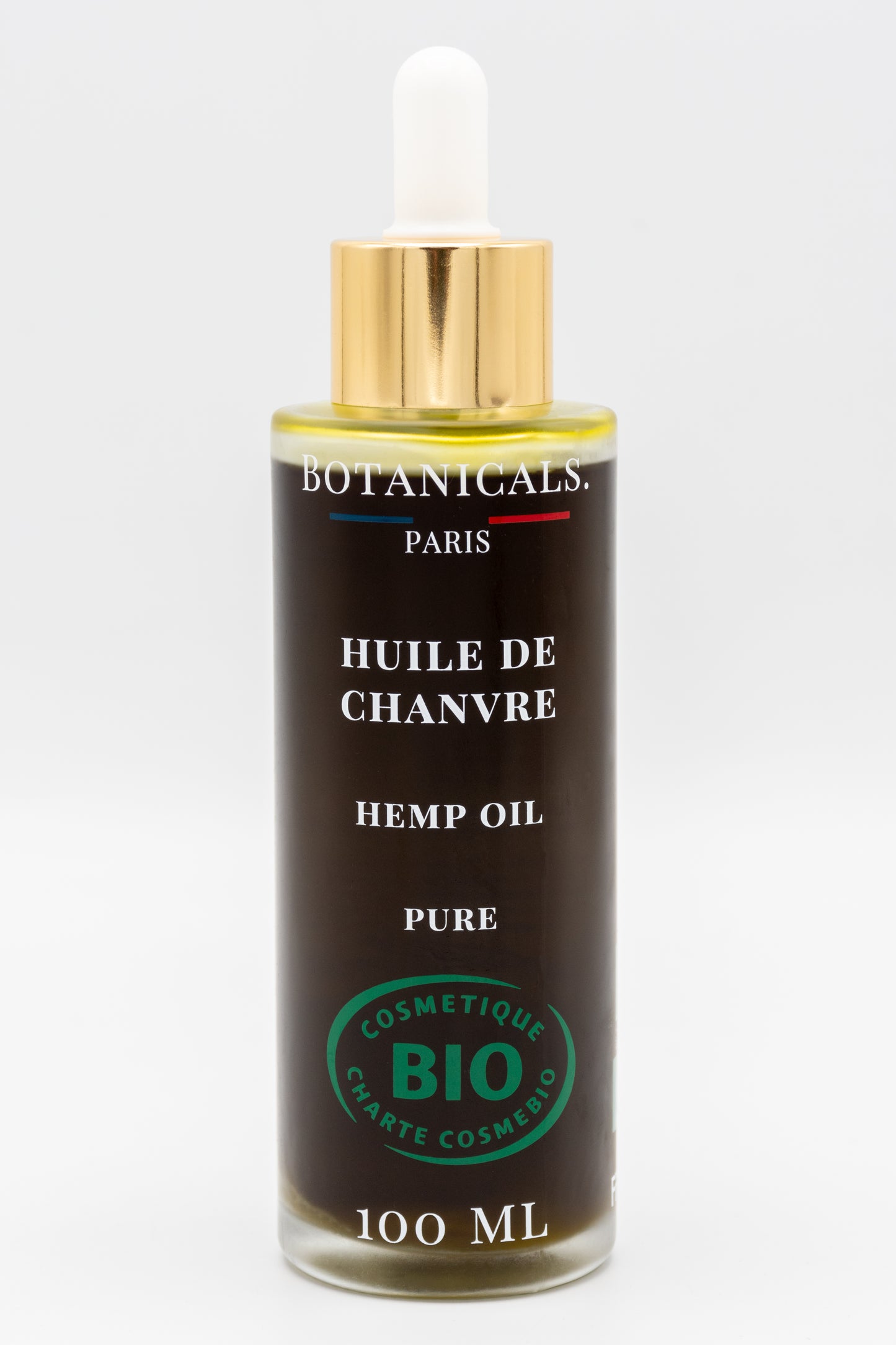 Une bouteille d'huile de chanvre bio 100ml Botanicals sur fond blanc