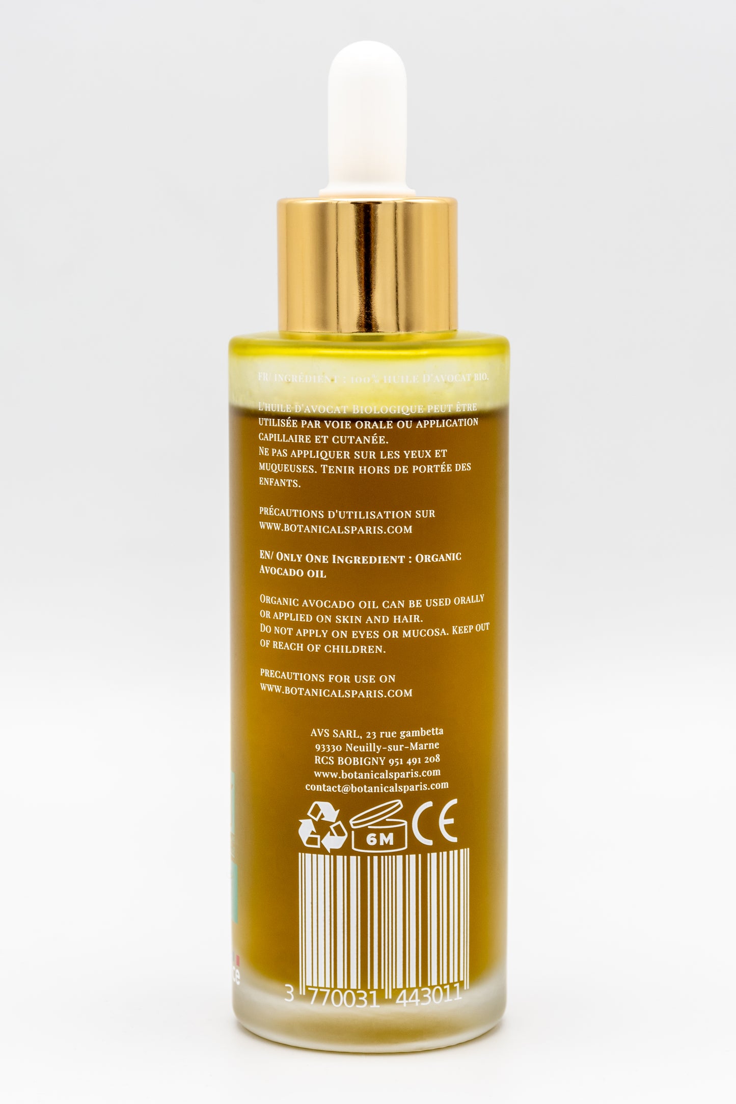 Une bouteille d'huile d'avocat bio 100ml Botanicals de dos sur fond blanc