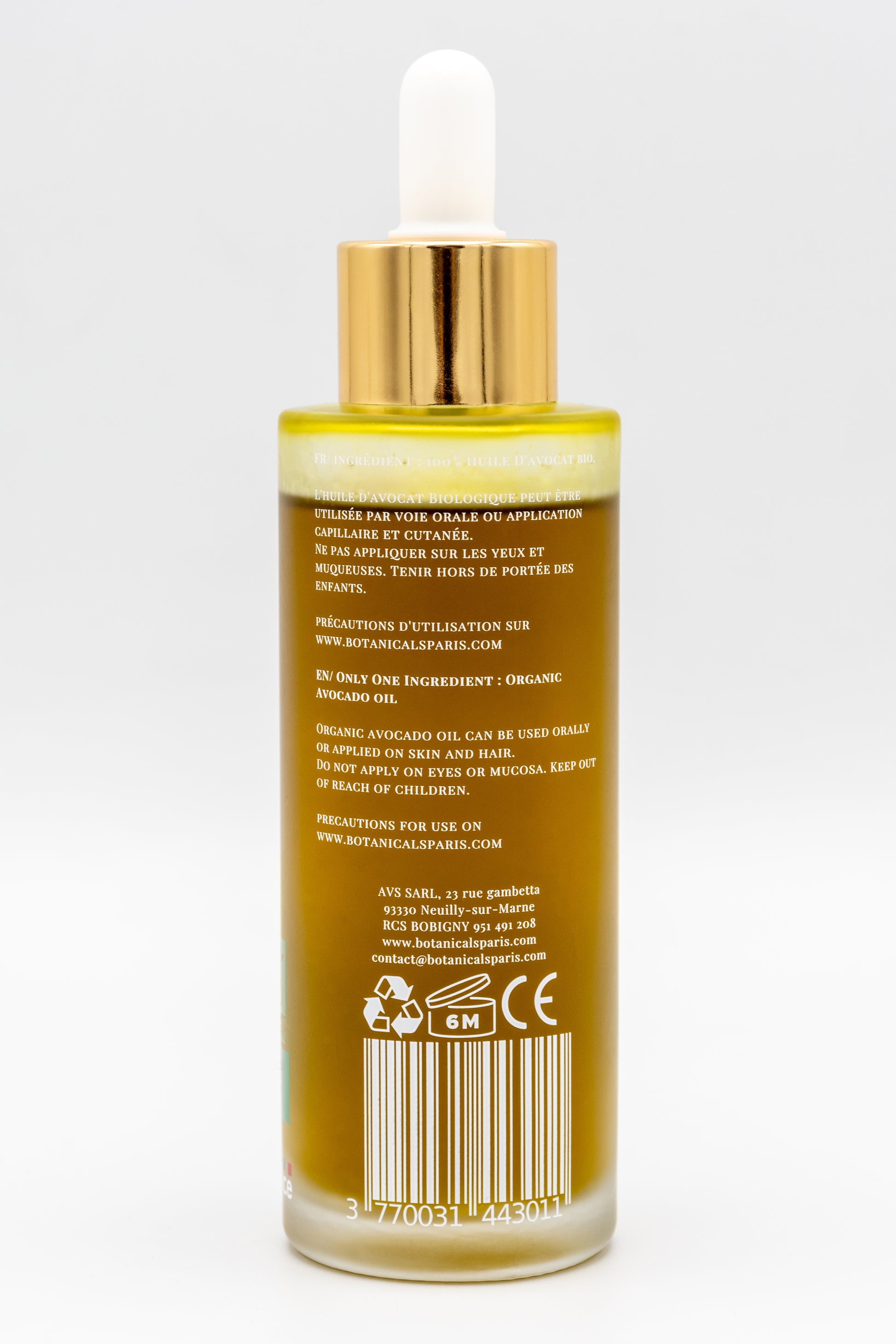Une bouteille d'huile d'avocat bio 100ml Botanicals de dos sur fond blanc