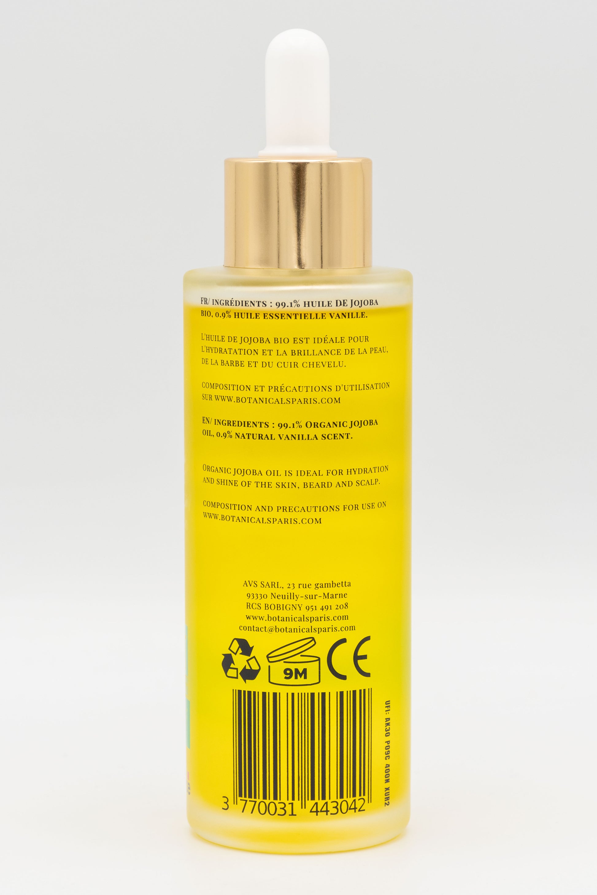 Une bouteille d'huile de jojoba bio 100ml Botanicals de dos sur fond blanc
