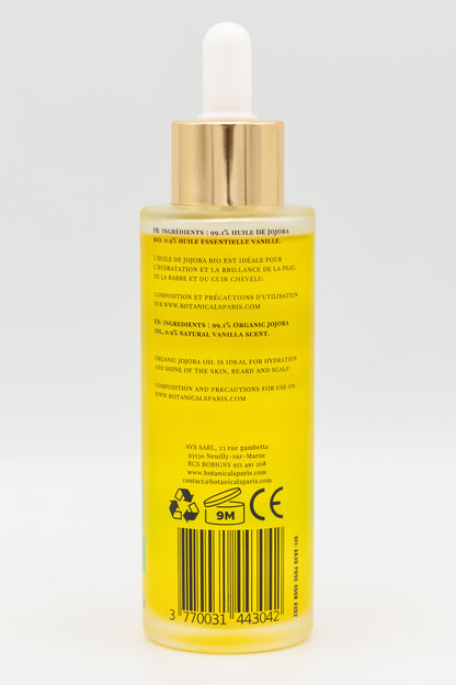 Une bouteille d'huile de jojoba bio 100ml Botanicals de dos sur fond blanc