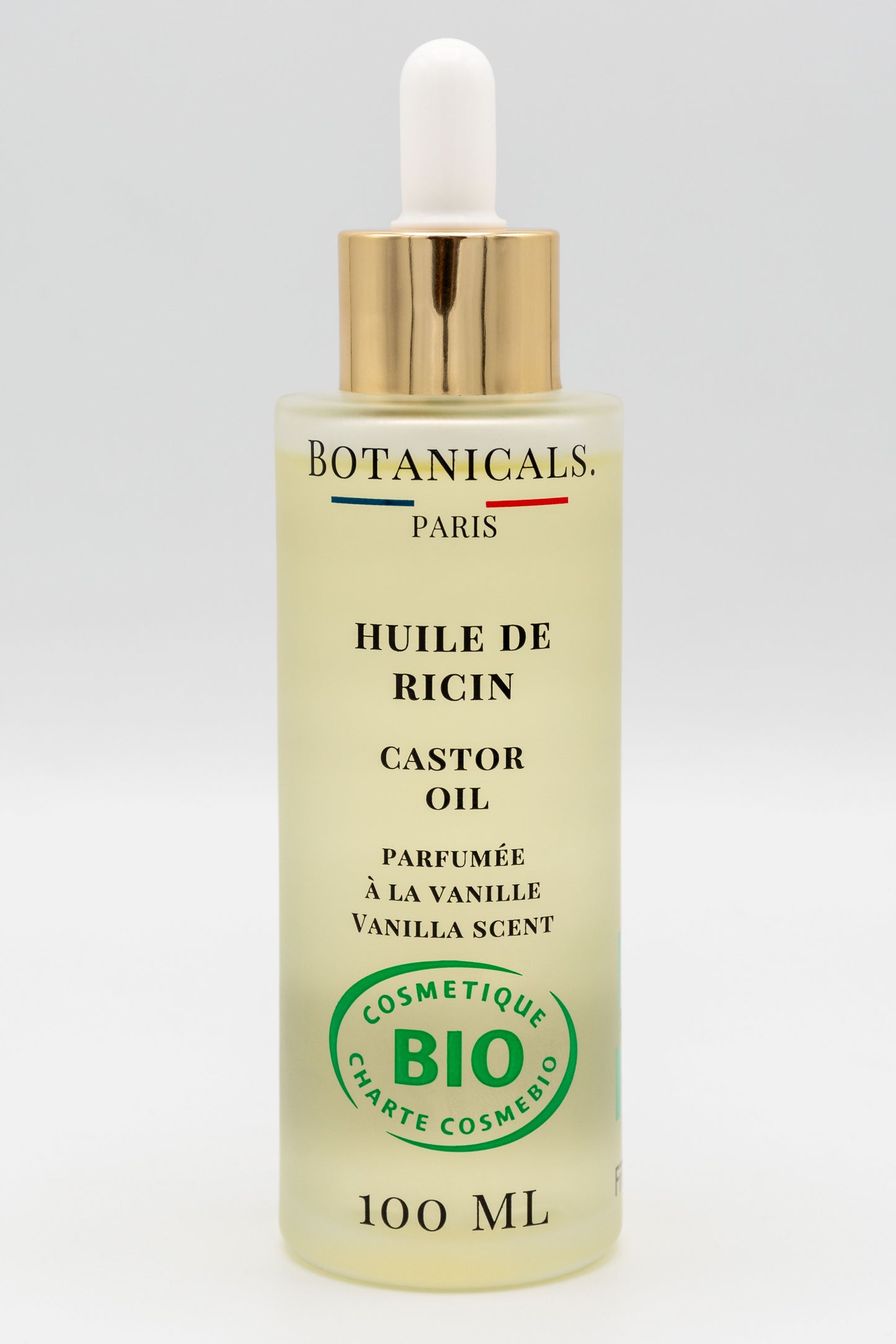 Une bouteille d'huile de ricin bio 100ml Botanicals sur fond blanc