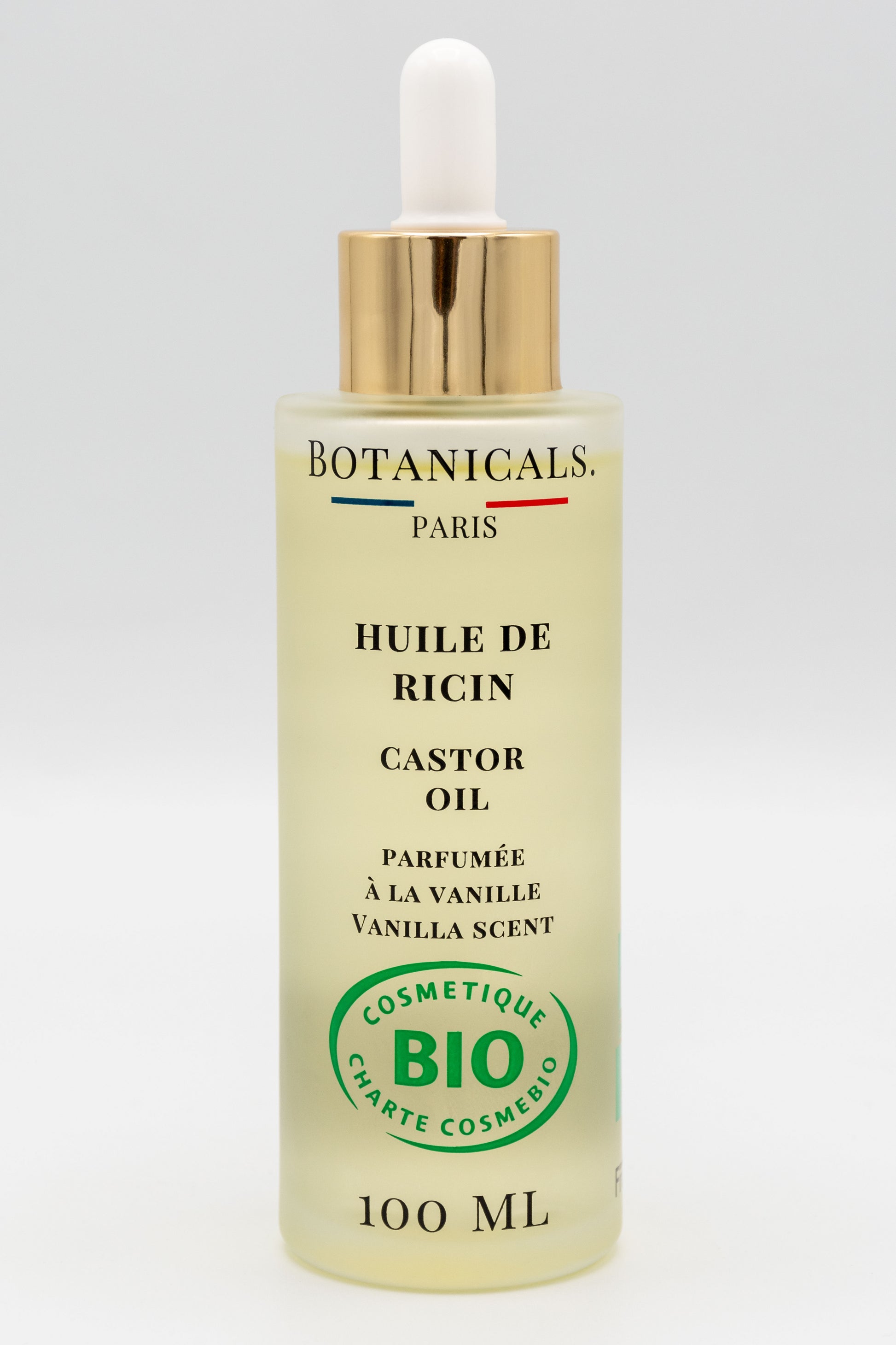 Une bouteille d'huile de ricin bio 100ml Botanicals sur fond blanc