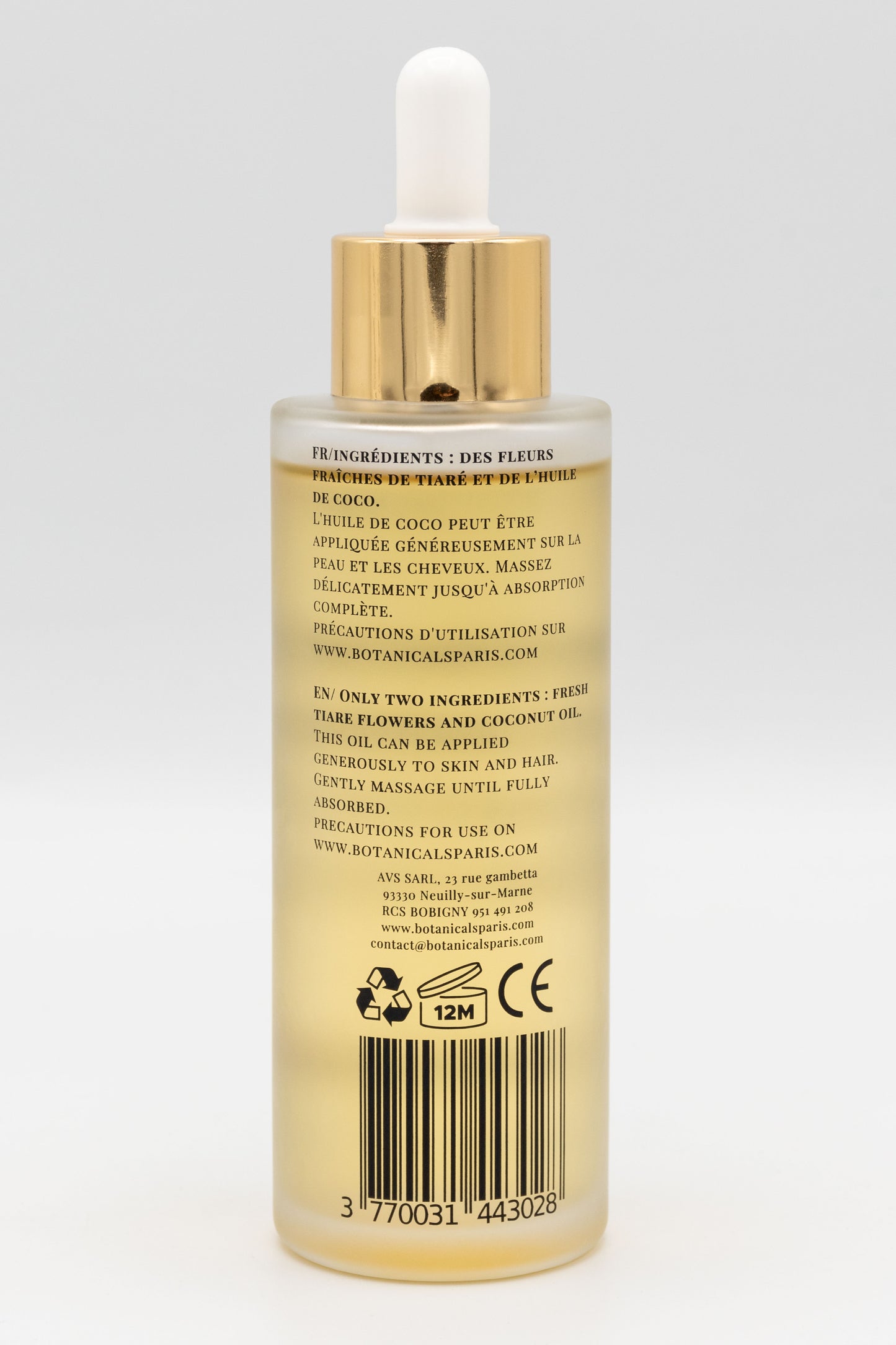 Une bouteille d'huile de monoï de Tahiti enrichi à l'huile de coco bio 100ml Botanicals de dos sur fond blanc
