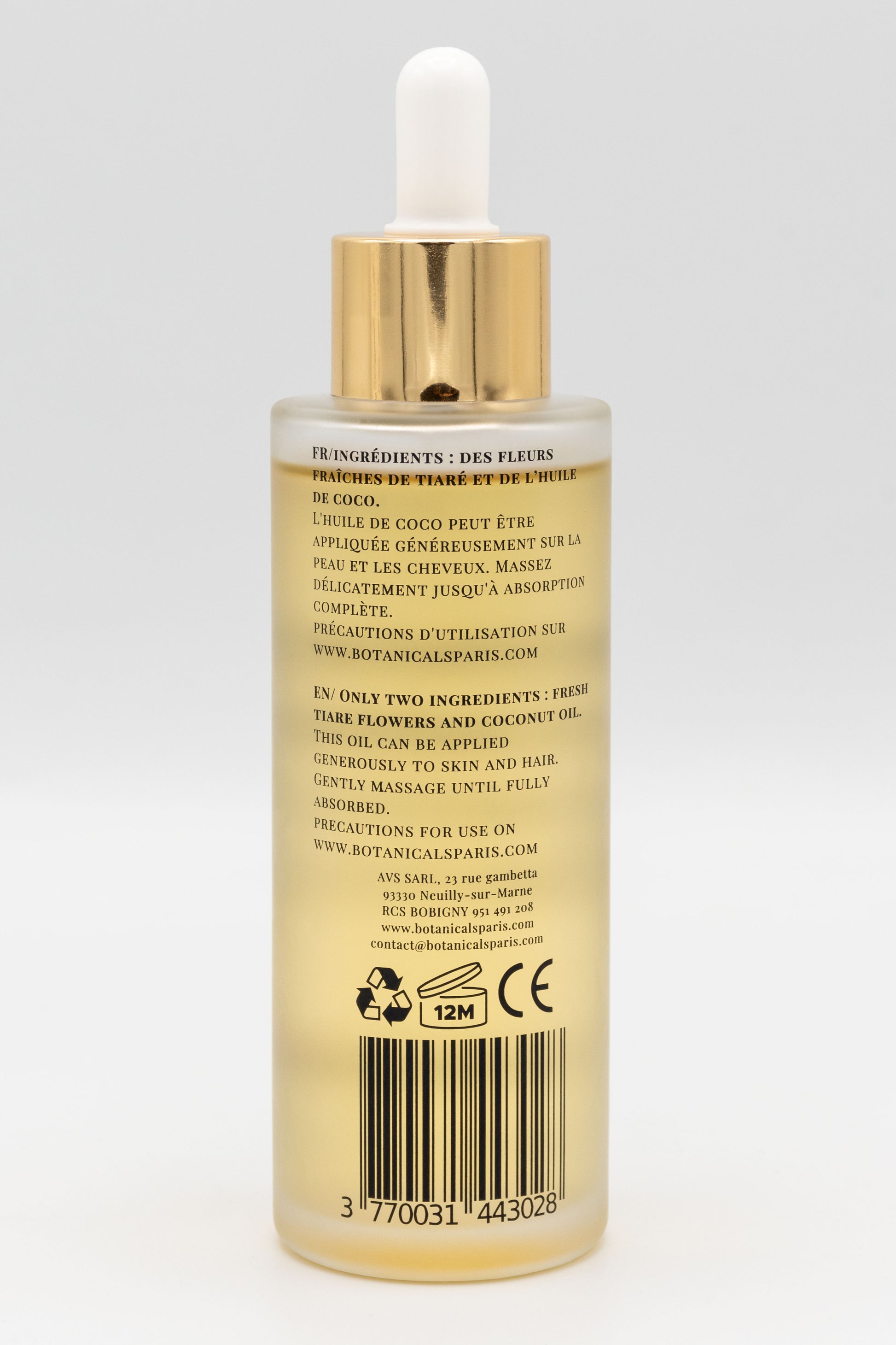 Une bouteille d'huile de monoï de Tahiti enrichi à l'huile de coco bio 100ml Botanicals de dos sur fond blanc
